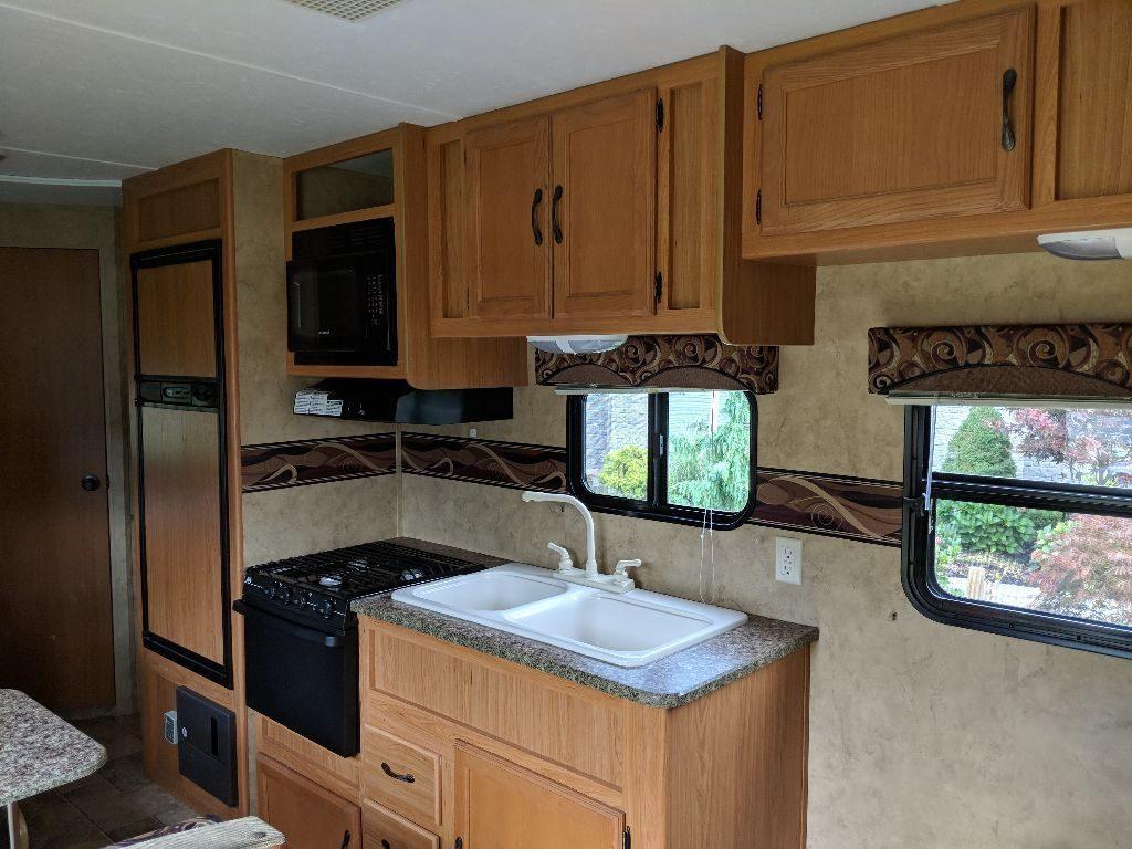 well equipped 2010 Keystone camper trailer