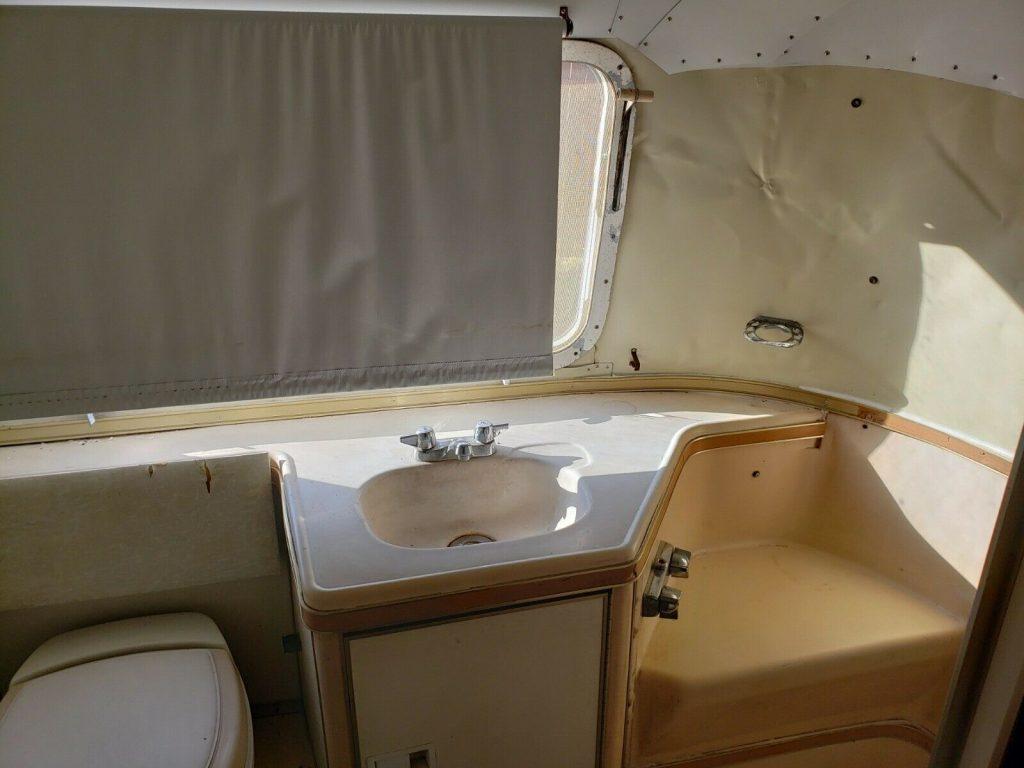 some dents 1975 Airstream Land Yacht camper