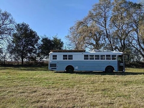 2002 Thomas Skoolie Tiny Home Conversion – Cozy Off-Grid Bus Cabin for sale